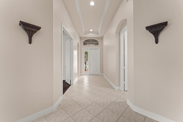 879 SW Pebble Ln, Palm City, FL 34990 - entrance foyer with recessed lighting, arched walkways, light tile patterned floors, and a raised ceiling