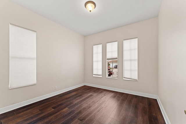 879 SW Pebble Ln, Palm City, FL 34990 - spare room with dark wood finished floors and baseboards