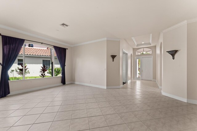 879 SW Pebble Ln, Palm City, FL 34990 - spare room featuring light tile patterned floors and crown molding