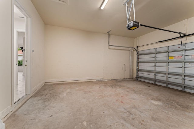 879 SW Pebble Ln, Palm City, FL 34990 - garage featuring a garage door opener