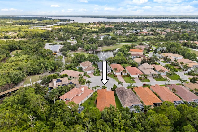 879 SW Pebble Ln, Palm City, FL 34990 - aerial overview of property's location featuring a nearby body of water and nearby suburban area
