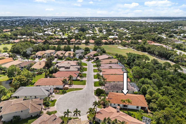 879 SW Pebble Ln, Palm City, FL 34990 - aerial perspective of suburban area featuring a large body of water