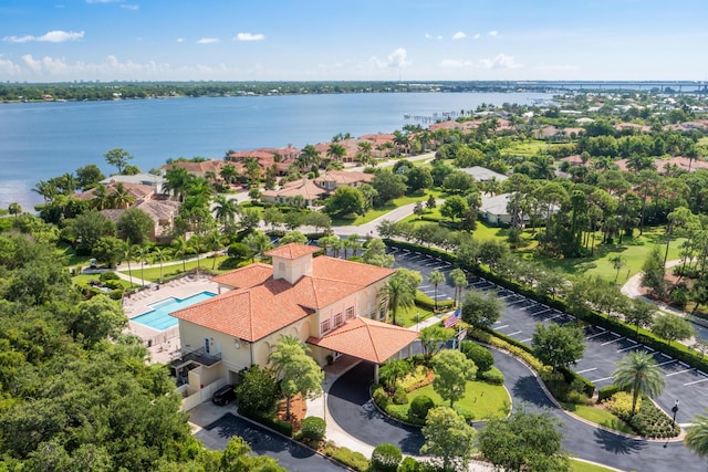 879 SW Pebble Ln, Palm City, FL 34990 - drone / aerial view of a pool area and a nearby body of water