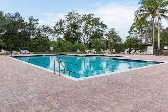 879 SW Pebble Ln, Palm City, FL 34990 - community pool with a patio area