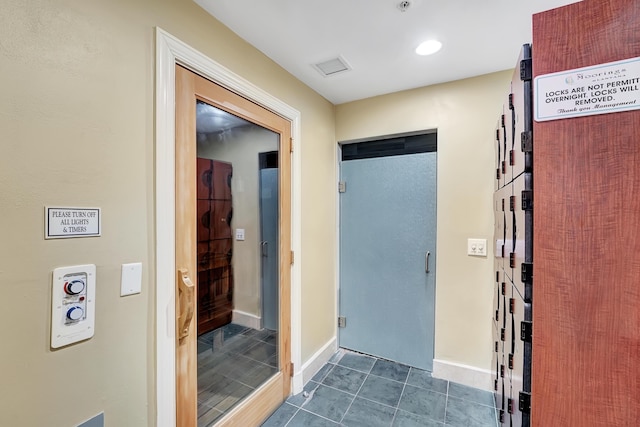 804 E Windward Way Unit 606, Lantana, FL 33462 - hallway with dark tile patterned flooring and recessed lighting