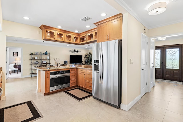 4220 NE 24th Ave, Lighthouse Point, FL 33064 - kitchen with appliances with stainless steel finishes, a peninsula, glass insert cabinets, crown molding, and recessed lighting