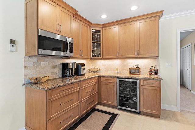 4220 NE 24th Ave, Lighthouse Point, FL 33064 - kitchen featuring stainless steel microwave, wine cooler, glass insert cabinets, light stone countertops, and tasteful backsplash