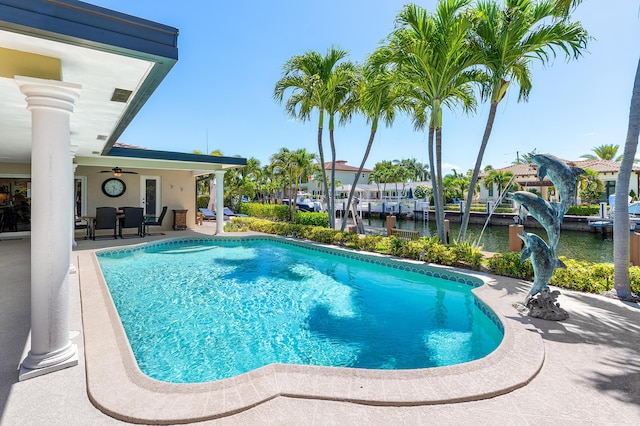 4220 NE 24th Ave, Lighthouse Point, FL 33064 - outdoor pool featuring a water view, a patio area, and ceiling fan
