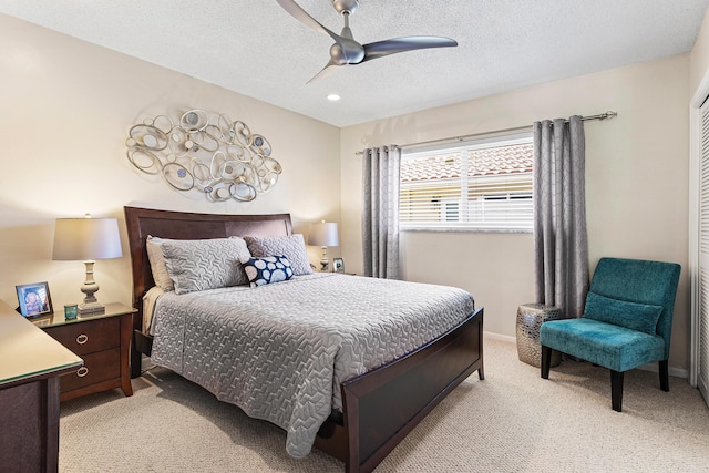 4220 NE 24th Ave, Lighthouse Point, FL 33064 - bedroom with light colored carpet, a textured ceiling, ceiling fan, and recessed lighting