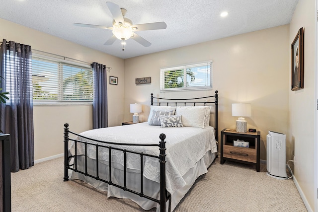 4220 NE 24th Ave, Lighthouse Point, FL 33064 - bedroom featuring light colored carpet, ceiling fan, and a textured ceiling