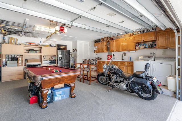 4220 NE 24th Ave, Lighthouse Point, FL 33064 - garage featuring independent washer and dryer, stainless steel fridge with ice dispenser, and a garage door opener