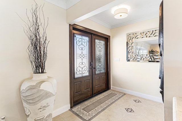 4220 NE 24th Ave, Lighthouse Point, FL 33064 - foyer entrance with ornamental molding, french doors, and light tile patterned flooring