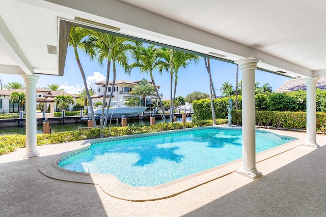 4220 NE 24th Ave, Lighthouse Point, FL 33064 - outdoor pool featuring a water view, boat lift, and a dock