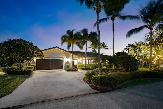 4220 NE 24th Ave, Lighthouse Point, FL 33064 - single story home featuring stucco siding, a garage, and concrete driveway