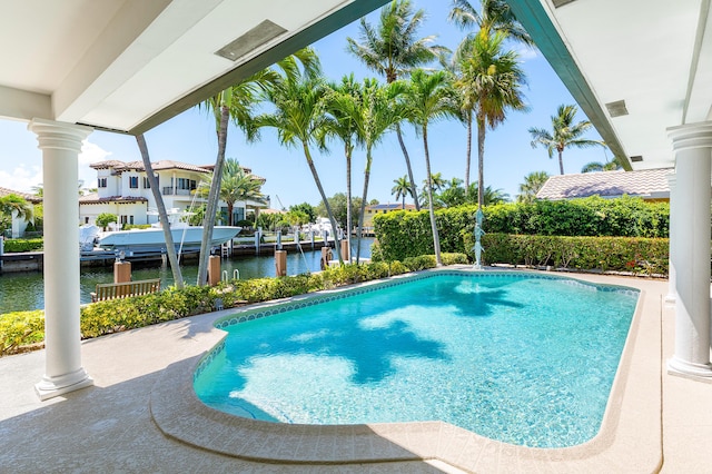 4220 NE 24th Ave, Lighthouse Point, FL 33064 - outdoor pool with a water view, boat lift, and a dock