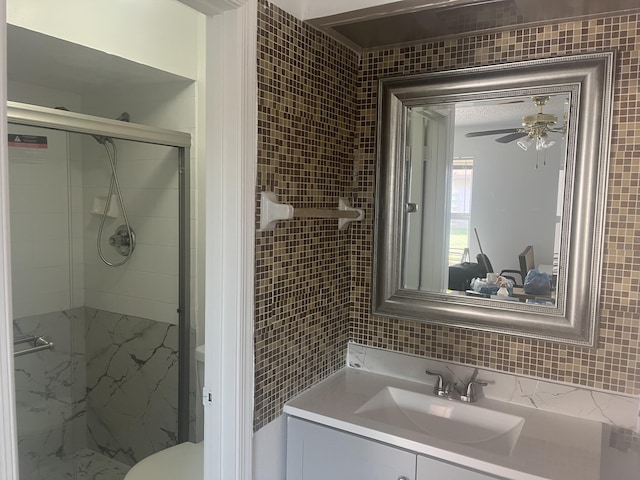 2548 Ida Way Unit 3A, West Palm Beach, FL 33415 - full bath with a stall shower, vanity, tile walls, a ceiling fan, and backsplash