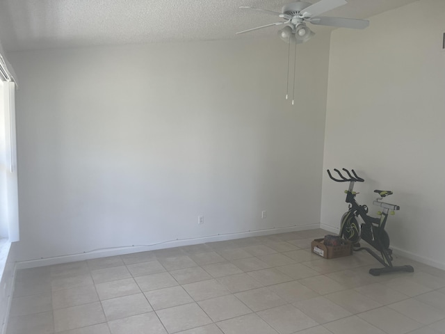 2548 Ida Way Unit 3A, West Palm Beach, FL 33415 - unfurnished room with ceiling fan, a textured ceiling, and light tile patterned floors
