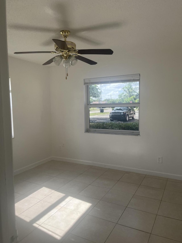 2548 Ida Way Unit 3A, West Palm Beach, FL 33415 - tiled spare room featuring a ceiling fan and baseboards
