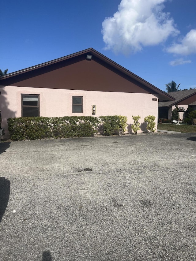 2548 Ida Way Unit 3A, West Palm Beach, FL 33415 - view of side of property featuring stucco siding
