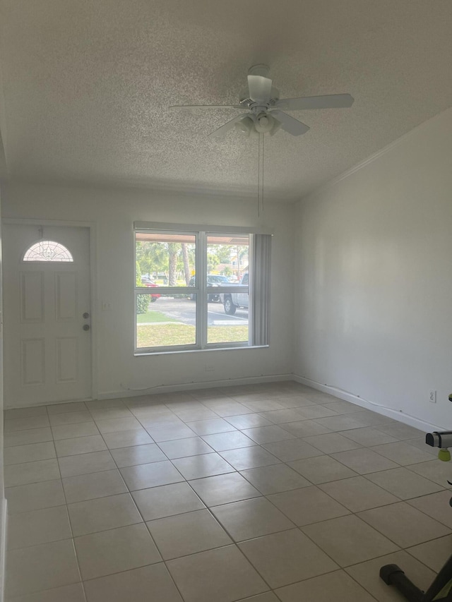 2548 Ida Way Unit 3A, West Palm Beach, FL 33415 - tiled foyer featuring a textured ceiling and a ceiling fan