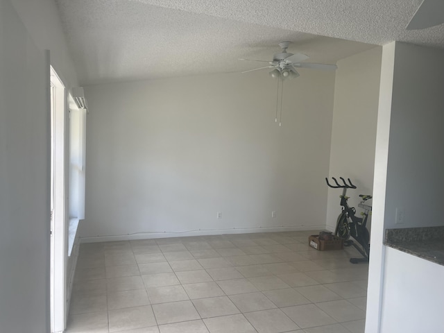 2548 Ida Way Unit 3A, West Palm Beach, FL 33415 - unfurnished room featuring a ceiling fan, a textured ceiling, and light tile patterned floors