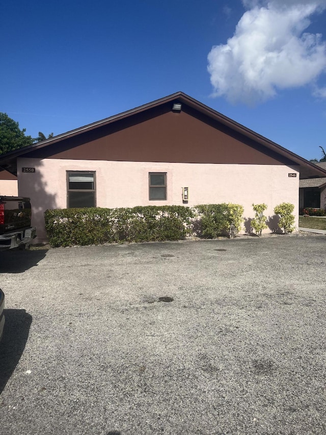 2548 Ida Way Unit 3A, West Palm Beach, FL 33415 - view of side of home with stucco siding