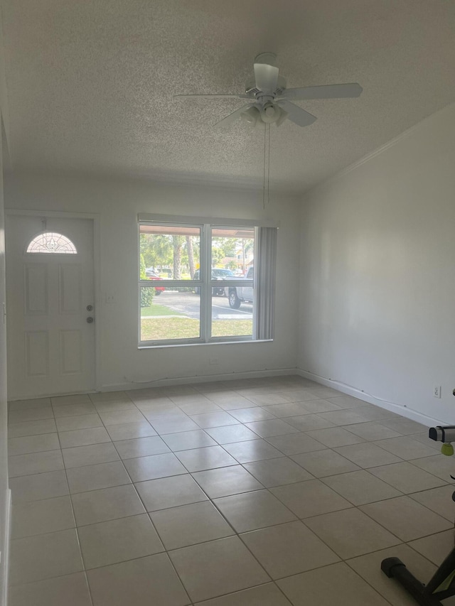 2548 Ida Way Unit 3A, West Palm Beach, FL 33415 - foyer entrance with tile patterned floors, a textured ceiling, and ceiling fan