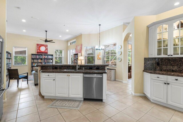 5422 Landon Cir, Boynton Beach, FL 33437 - kitchen featuring dishwasher, ceiling fan, light tile patterned flooring, arched walkways, and glass insert cabinets