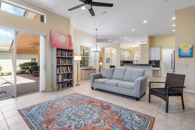 5422 Landon Cir, Boynton Beach, FL 33437 - living room with ceiling fan, light tile patterned floors, crown molding, recessed lighting, and arched walkways