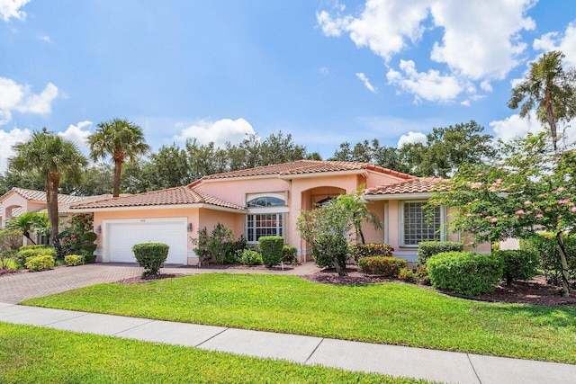 5422 Landon Cir, Boynton Beach, FL 33437 - mediterranean / spanish home featuring a tiled roof, an attached garage, stucco siding, and driveway