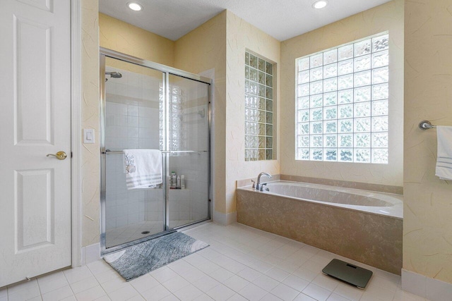 5422 Landon Cir, Boynton Beach, FL 33437 - full bathroom with a bath, a stall shower, tile patterned flooring, and recessed lighting
