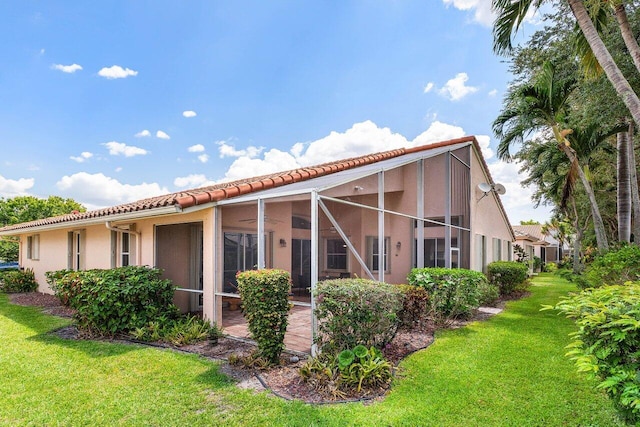 5422 Landon Cir, Boynton Beach, FL 33437 - back of house featuring a tiled roof, a yard, and stucco siding