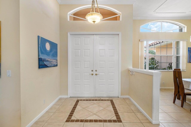 5422 Landon Cir, Boynton Beach, FL 33437 - entrance foyer featuring ornamental molding and light tile patterned floors