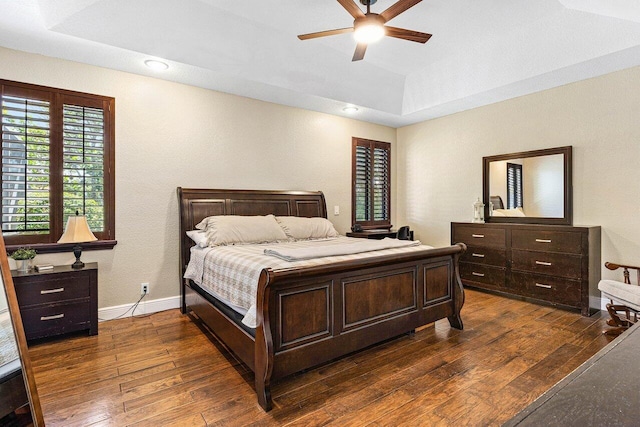 5336 NW 57th Way, Coral Springs, FL 33067 - bedroom with dark wood finished floors, multiple windows, a tray ceiling, and ceiling fan