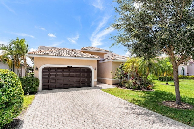 5336 NW 57th Way, Coral Springs, FL 33067 - mediterranean / spanish home with stucco siding, a garage, decorative driveway, and a tile roof
