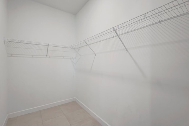 556 SE Mulberry Way, Port Saint Lucie, FL 34984 - spacious closet featuring light tile patterned floors