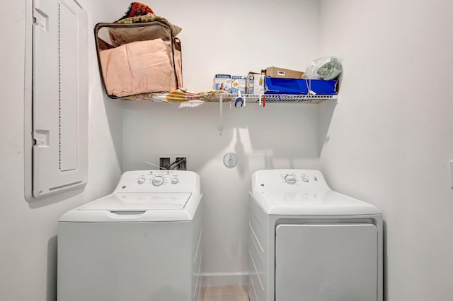 556 SE Mulberry Way, Port Saint Lucie, FL 34984 - laundry area featuring separate washer and dryer and baseboards