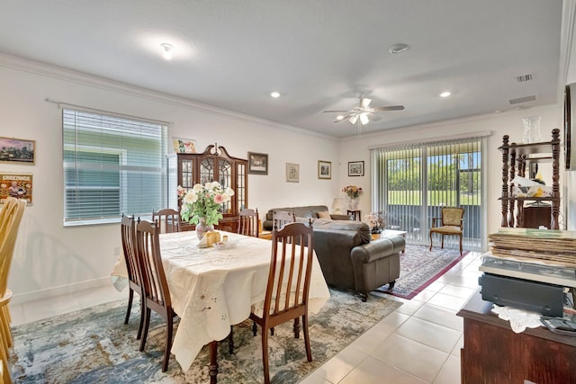 556 SE Mulberry Way, Port Saint Lucie, FL 34984 - dining space featuring a ceiling fan, crown molding, light tile patterned flooring, and recessed lighting