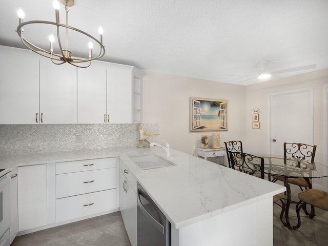 1206 12th Ct, Jupiter, FL 33477 - kitchen with stainless steel dishwasher, a peninsula, light stone countertops, and white cabinets