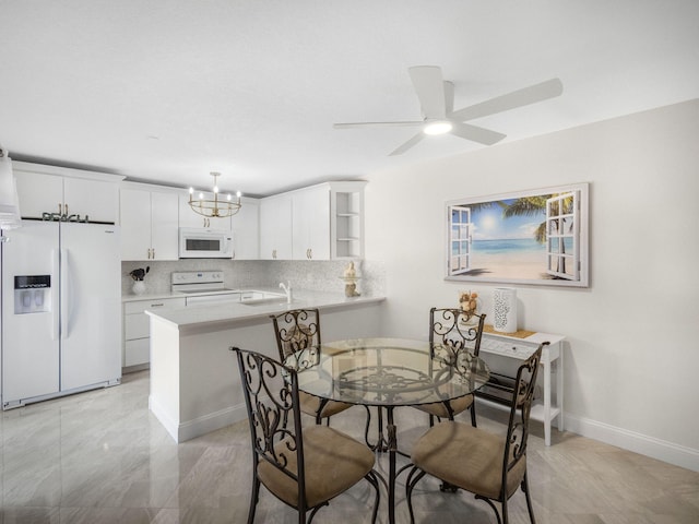 1206 12th Ct, Jupiter, FL 33477 - dining area with a chandelier and a ceiling fan