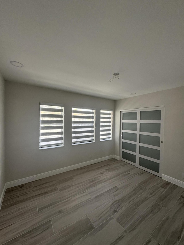 8711 Eagle Run Dr, Boca Raton, FL 33434 - spare room featuring wood finished floors