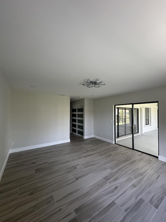 8711 Eagle Run Dr, Boca Raton, FL 33434 - spare room featuring baseboards and wood finished floors