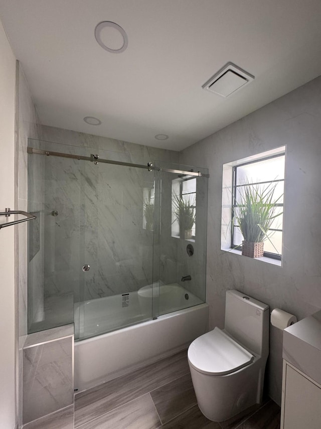 8711 Eagle Run Dr, Boca Raton, FL 33434 - full bathroom featuring shower / bath combination with glass door, vanity, and wood finished floors