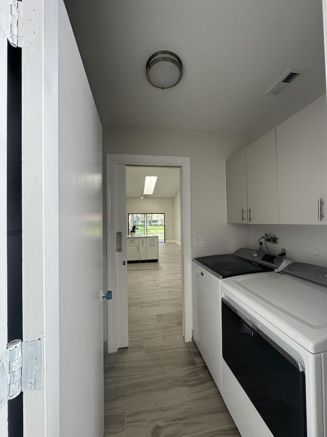 8711 Eagle Run Dr, Boca Raton, FL 33434 - washroom featuring cabinet space and washer and clothes dryer
