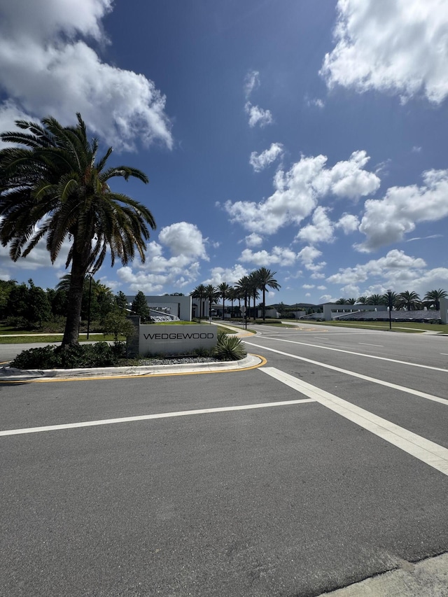 8711 Eagle Run Dr, Boca Raton, FL 33434 - view of asphalt road with curbs and sidewalks