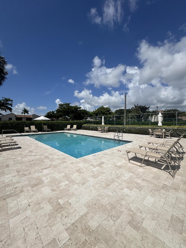 8711 Eagle Run Dr, Boca Raton, FL 33434 - community pool with a patio