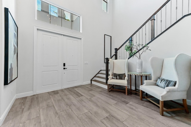 4112 Italia Way, Lake Worth, FL 33467 - entrance foyer featuring a towering ceiling, stairway, and light wood-style floors