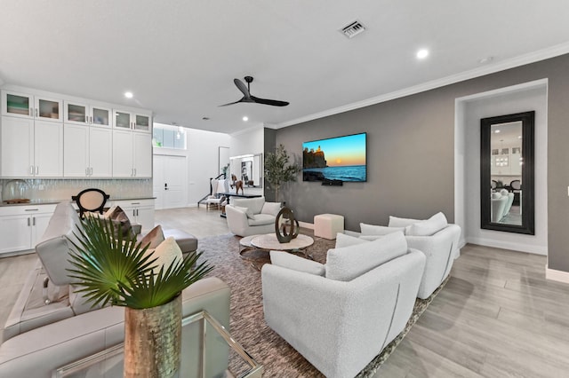4112 Italia Way, Lake Worth, FL 33467 - living room with recessed lighting, a ceiling fan, ornamental molding, and light wood-style flooring