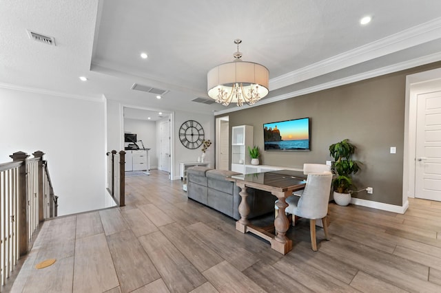 4112 Italia Way, Lake Worth, FL 33467 - dining room featuring recessed lighting, a tray ceiling, light wood-style flooring, a chandelier, and crown molding