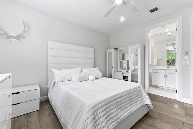 4112 Italia Way, Lake Worth, FL 33467 - bedroom featuring ensuite bath, wood finished floors, and ceiling fan